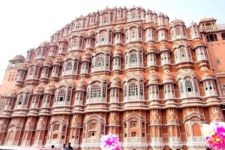 Ride up to Amber Fort, tour the pink city of Jaipur, and see its landmarks lit up on a night jeep tour