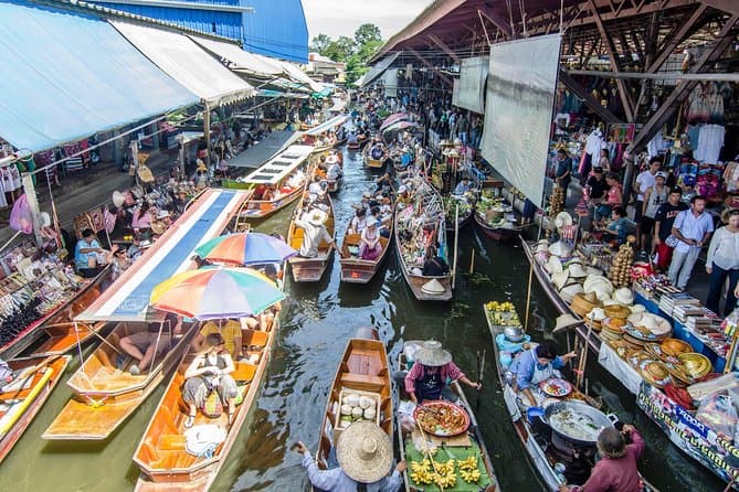 The floating market of Damnoen Saduak and a longtail boat to a jungle resort on the River Kwai