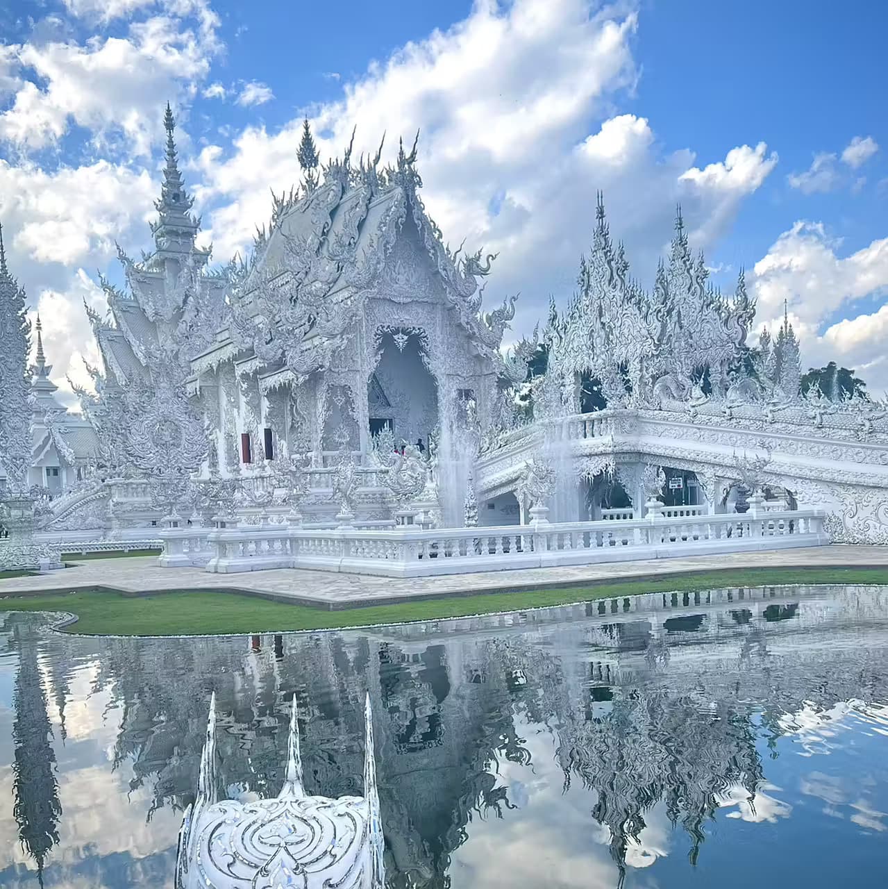 The Golden Triangle over the Mekong, the dazzling White Temple, and golden Doi Suthep above Chiang Mai