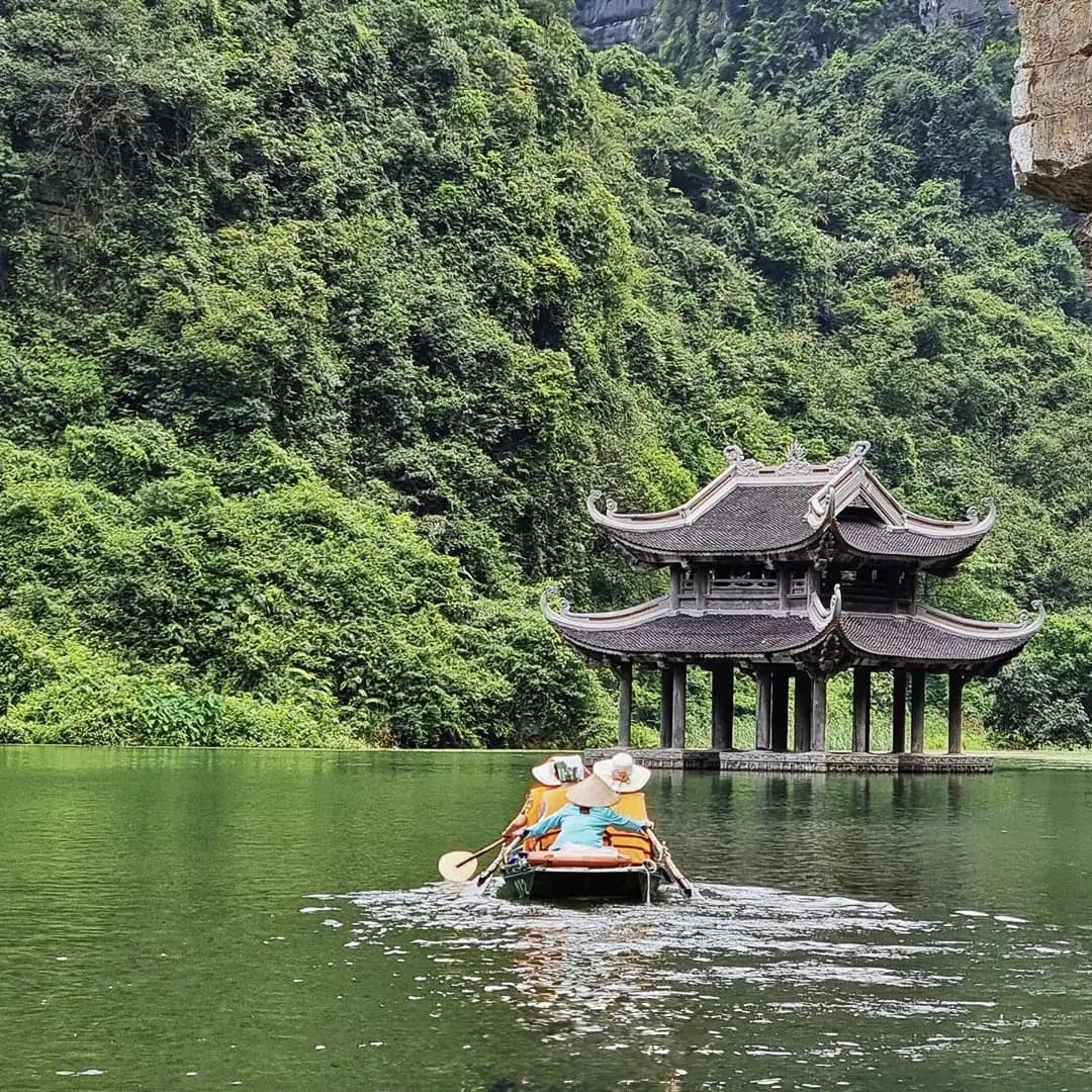 A traditional sampan boat ride through the caves and rice fields of Ninh Binh